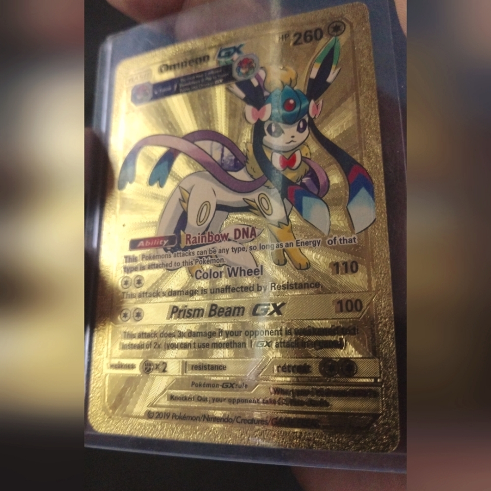 Omneon GX gold foil pokemon card